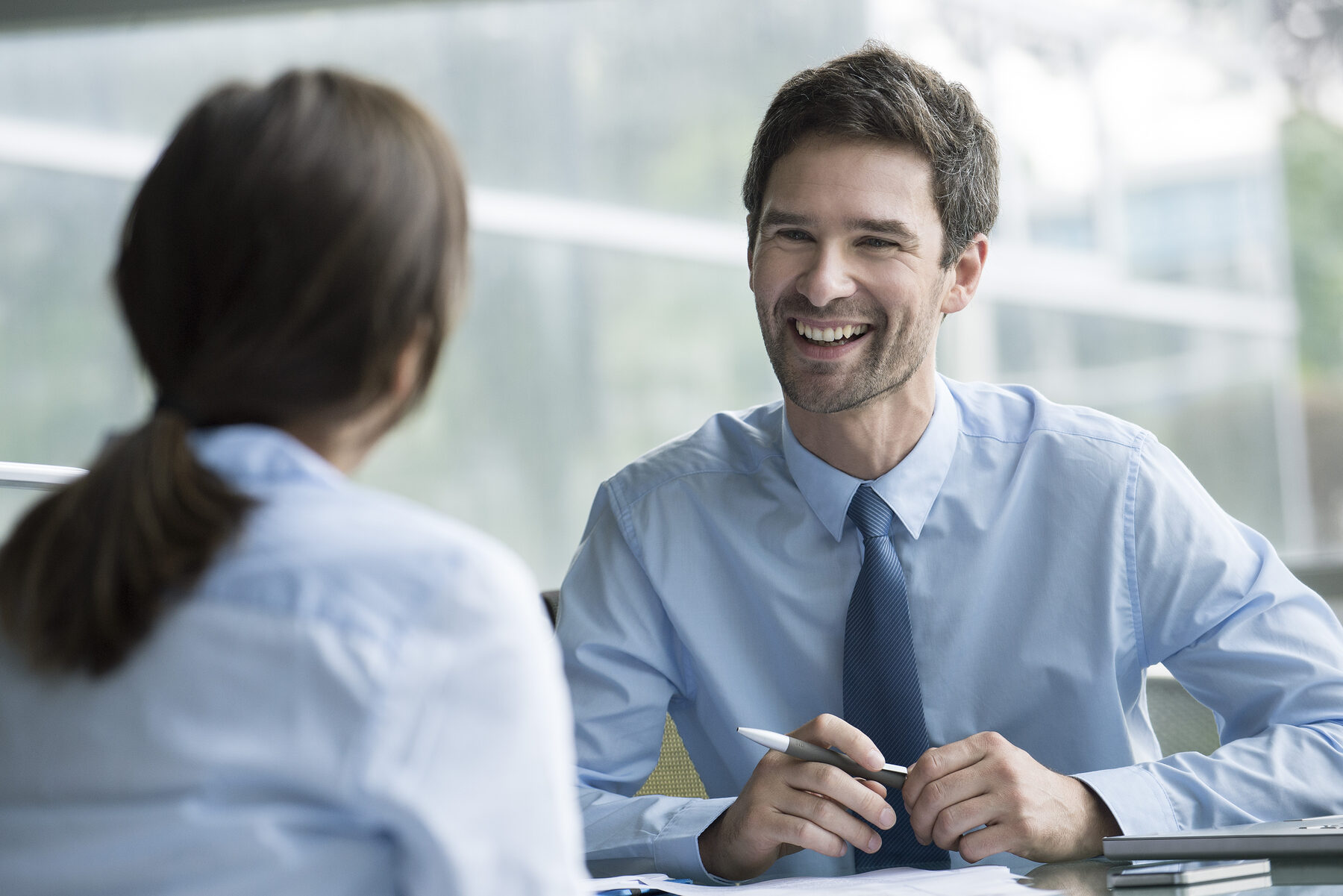 A candidate shaking hands with an interviewer